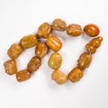 A group of carved agate beads