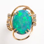 A black opal, diamond and fourteen karat gold ring