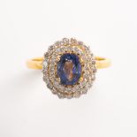 A sapphire, diamond and eighteen karat gold ring