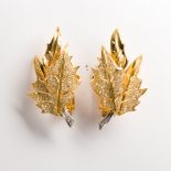 A pair of diamond and eighteen karat gold earclips