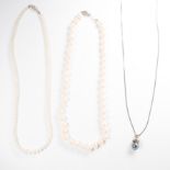 A group of three pearl necklaces