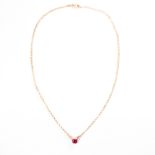 A synthetic ruby, moissonite and fourteen karat gold necklace