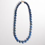 A lapis bead necklace