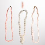 A group of coral bead necklaces