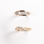 A group of diamond and fourteen karat gold band rings