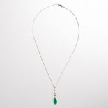 An emerald, diamond and fourteen karat gold pendant necklace