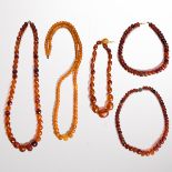 A group of amber necklaces