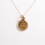 A gold coin pendant necklace