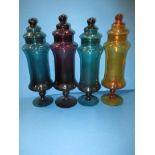 4 Vintage glass chemist bottles in various colours