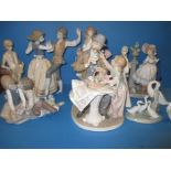 A quantity of vintage lladro and other figures