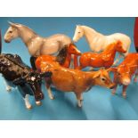 A quantity of John Beswick horse and cow figures