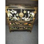 A Chinese lacquer cabinet