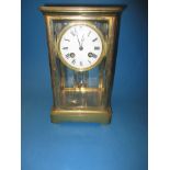 A vintage French 4 glass clock with mercury pendulum