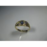 An 18ct yellow gold ring set with 4 diamonds a 3 blue sapphires, approx finger size J