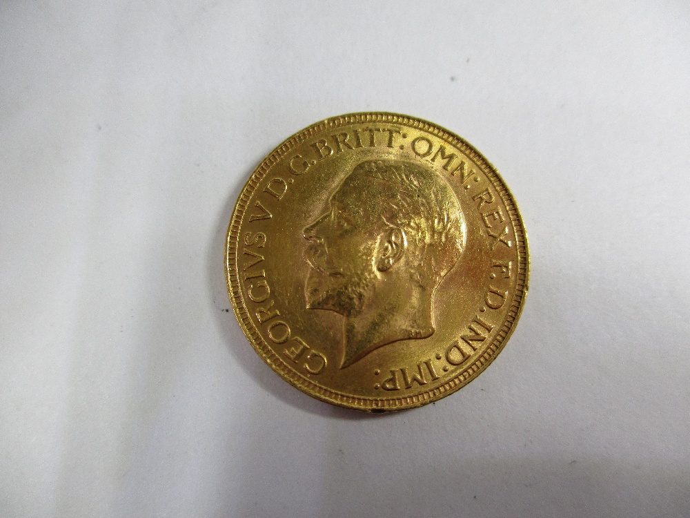 A 1930 George V gold full sovereign in a good grade - Image 3 of 8
