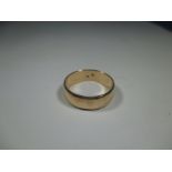 A Hungarian gold wedding band, possibly 18ct. Approx weight 5.5g