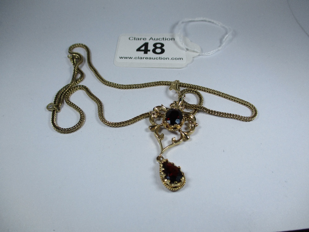 A gold pendant set with garnets with a 9ct fox tail chain, approx weight 10.9g - Image 7 of 7