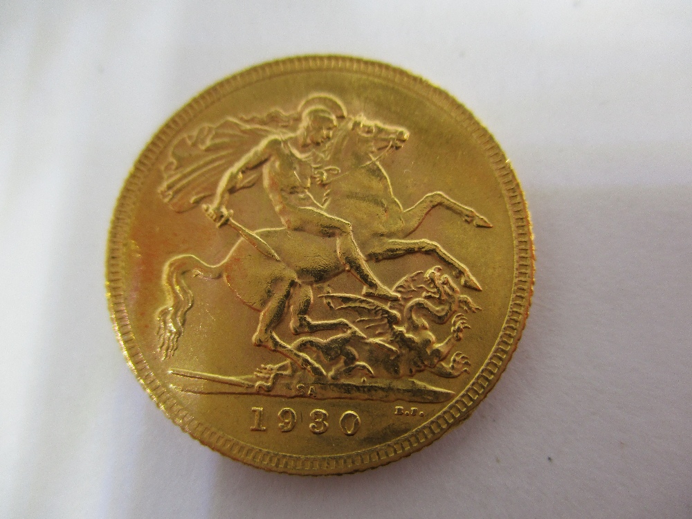 A 1930 George V gold full sovereign in a good grade - Image 5 of 8