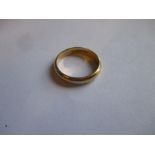 An 18ct gold wedding band, approx weight 4.2