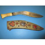 A bone handled kukri in gem set scabbard