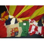 A quantity of vintage flags, some maritime signal flags