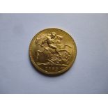 A 1930 George V gold full sovereign in a good grade