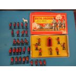 A boxed set of Crescent Toys metal soldiers and a quantity of metal band figures