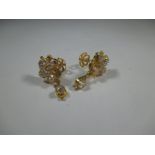 A pair of 22ct gold earrings set with CZ
