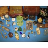 A parcel of interesting items to include coins, silver top pots and scent bottles
