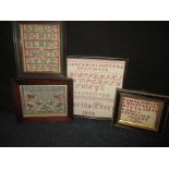 Four small samplers one on fine silk