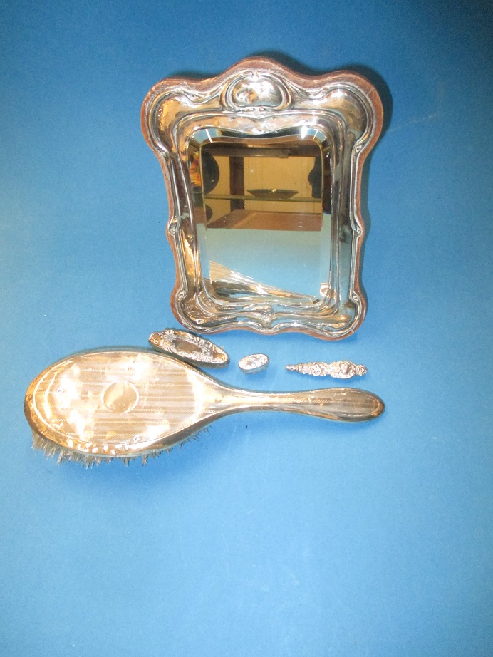 A sterling silver easel mirror and other silver items