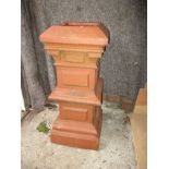 A vintage terracotta chimney pot