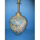 A large ceramic lamp body with tube lined decoration in the cloisonné style