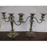 A pair of plated 3 branch candlesticks