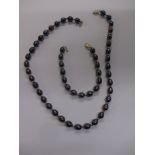 A coloured cultured Akoya pearl necklace and bracelet set with 9ct gold clasps