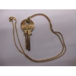 A 9ct gold necklace with 9ct key pendant, approx weight 17.8g