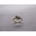 An antique gold ring set with 3 diamonds, approx finger size L