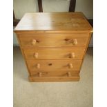 A small waxed pine chest of 4 drawers