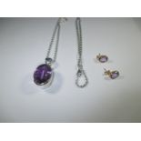 A pair of 585 gold and amethyst earrings and a silver necklace with a large amethyst pendant