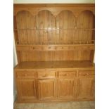 A large pine kitchen dresser and rack