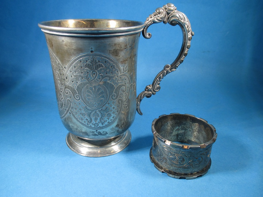 A Victorian silver mug and a silver napkin ring