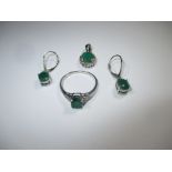 A ring, pendant and earrings all on 9ct white gold set with emeralds
