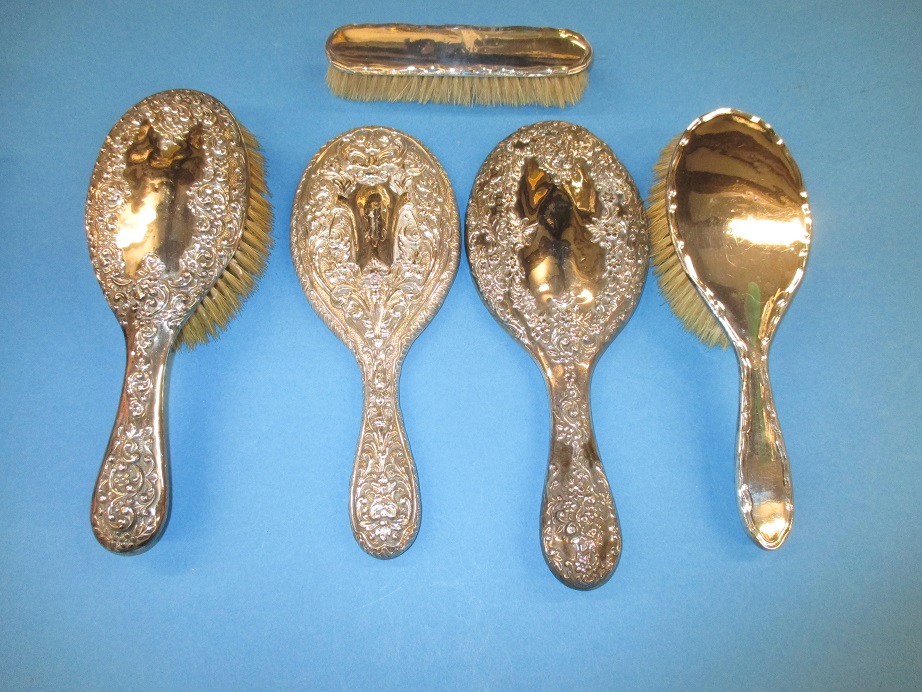 A quantity of silver backed dressing table items