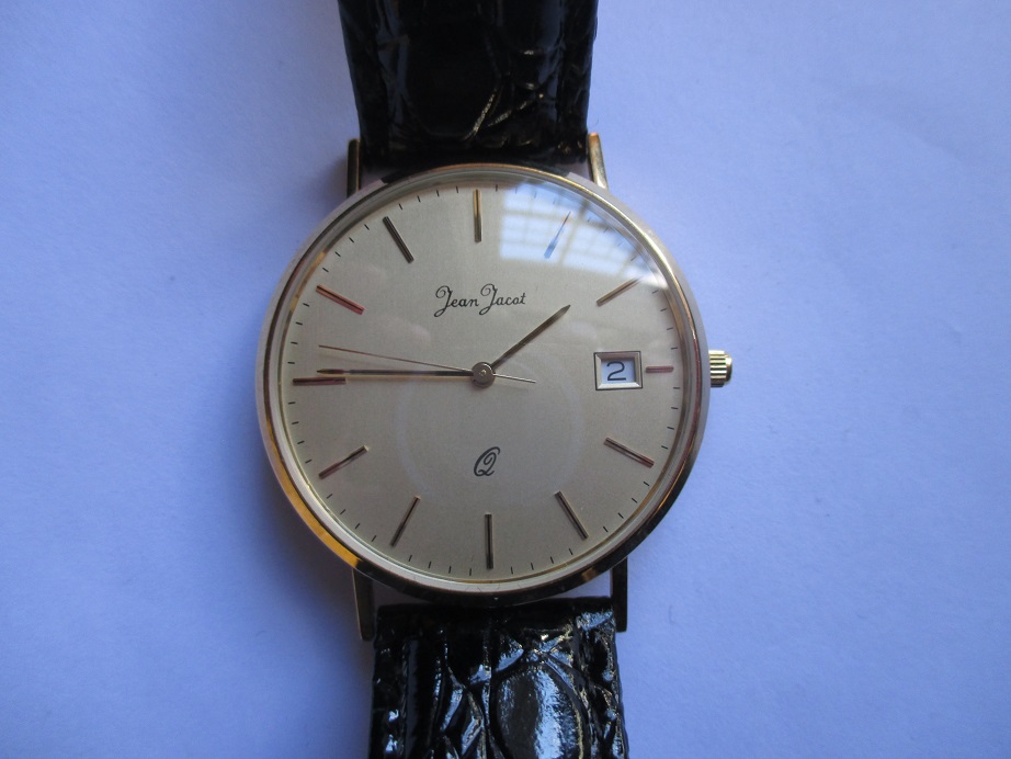 A gents 9ct gold cased wristwatch in unused condition
