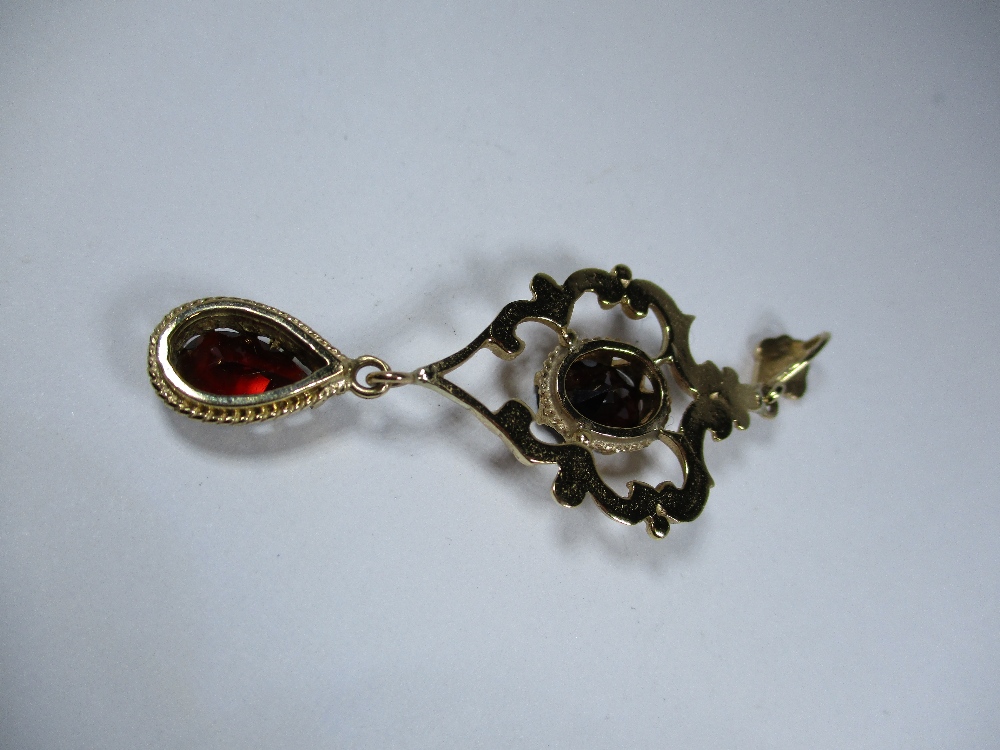 A gold pendant set with garnets with a 9ct fox tail chain, approx weight 10.9g - Image 3 of 7