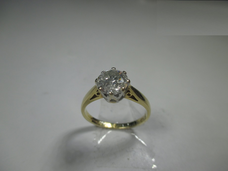 An 18ct gold and diamond solitaire ring, the stone measuring approx 6.69mm