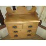 A 19th century waxed pine chest of 2 short over 2 long drawers with wash stand top