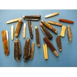A collection of vintage pocket knives.
