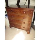 An antique mahogany chest of 2 short over 3 graduated long drawers