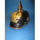 A reproduction Imperial German Picklehaube helmet
